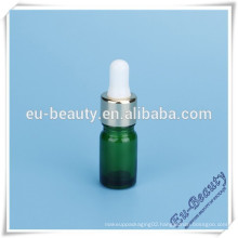 Green essential oil dropper bottle